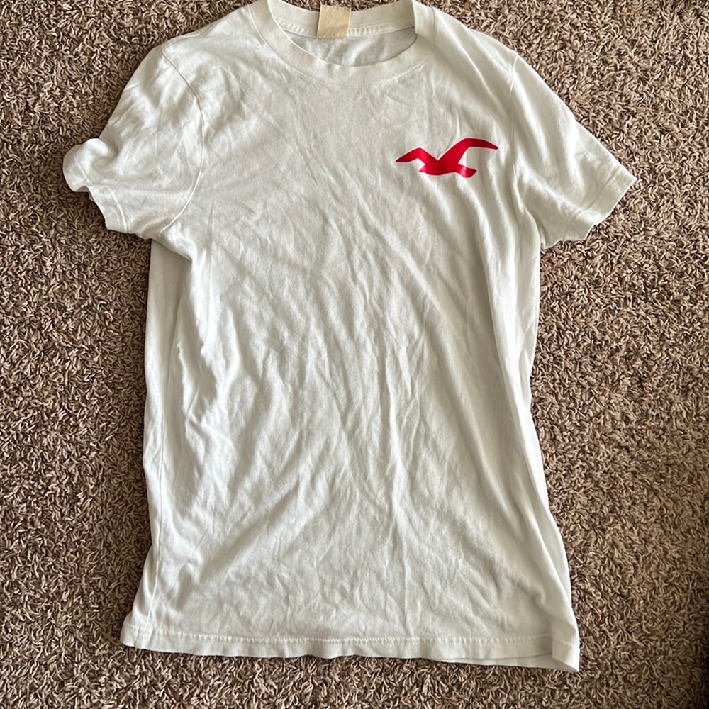 Used white Hollister shirt red letters. Size small.
